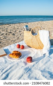 Summer Picnic On The Beach By The Sea At A Sunrise. Warm Sunny Morning.