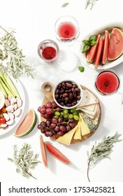 Summer Picnic Table Setting With Cheese Board Wine And Watermelon, Top Down View