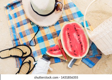 Summer Picnic Time On A Beach. Fresh Water Melon On Checkered Cloth. Top View