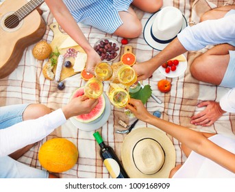 Summer Picnic With White Wine Top View. Toasting People