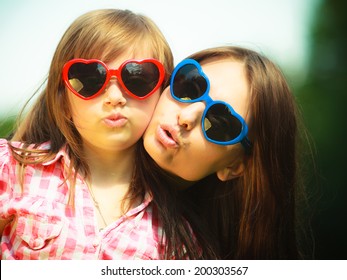 Summer. Portrait Of Mother With Daughter Having Fun. Woman And Girl Child Kid In Sunglasses Making Funny Faces Outdoor.