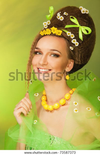 Summer\
queen - attractive woman with bows and flowers in her hair and\
dress, with professional hairstyle and make\
up