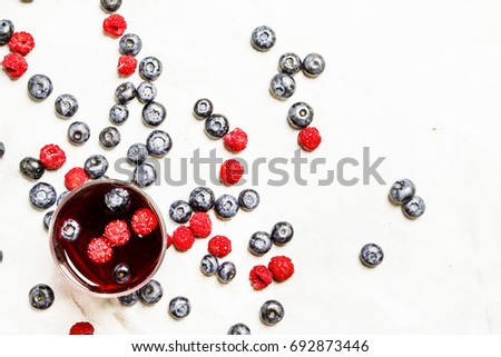 Summer red berry drink with blueberry and raspberry, top view