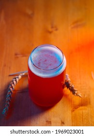 Summer Red Fruit Craft Beer Sour Ale. Stylish Glass In The Form Of A Can Of Beer. Wooden Table