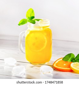 Summer Refreshing Cocktail With Lemon, Mint And Ice In Glass. Square Image.