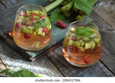 Summer Refreshing Drink With Rhubarb, Raspberries And Mint. Rhubarb Lemonade. A Glass Of Fresh Cool Summer Rhubarb Mojito Cocktail