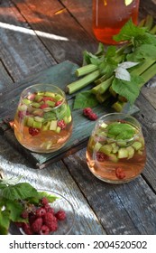 Summer Refreshing Drink With Rhubarb, Raspberries And Mint. Rhubarb Lemonade. A Glass Of Fresh Cool Summer Rhubarb Mojito Cocktail