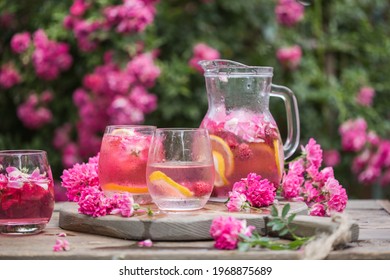 Summer Refreshment Drinks. Light Pink Rose Cocktail, With Rose Wine Over Natural Garden