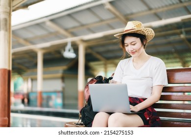 Summer, Relax, Vacation, Travel, Portrait Of Beautiful Asian Girl Using The Computer Laptop At The Train Station While Waiting For Their Travel Time.