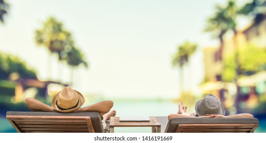 Summer Resort Hotel Stay Relaxation With Tourist Traveller Couple Take It Easy Happily Resting On Beach Chair On Holiday Travel Vacation Poolside Peacefully At Tropical Beach House Swimming Pool