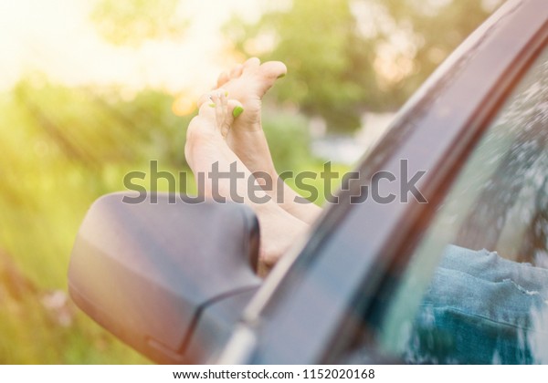 Summer
road trip car vacation concept. Woman legs out the windows in car.
Conceptual freedom, travel and holidays
image.