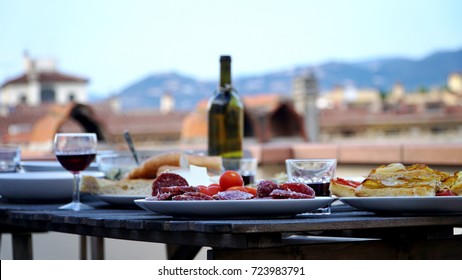 A Summer Rooftop Dinner Prepared In Florence Italy At Sunset.