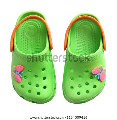 Summer rubber crocs shoes pair isolated.