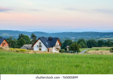 Summer rural landscape. Construction of a new home in the countryside. - Shutterstock ID 765005899