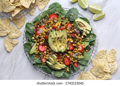 Summer Salad With Corn, Kale, Strawberries, And Avocado