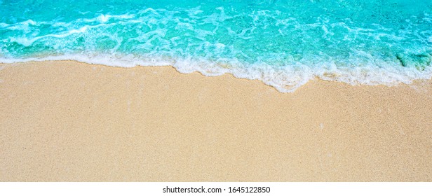 Summer sandy beach Background / wave, sea and sand for free space for you to put text. - Shutterstock ID 1645122850