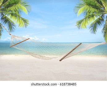 Summer Sandy Beach With Hammock And Coconut Tree On Blur Ocean And Sky Background. Concept Vacation Relax.