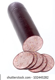 Summer Sausage Sliced And Isolated On White.