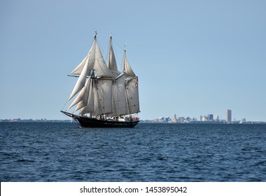 A Summer Scene Is Captured As A Tall Ship Makes It's Way Past The Skyline Of Buffalo NY.