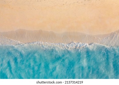 Summer seascape beautiful waves, blue sea water in sunny day. Top view from drone. Sea aerial view, amazing tropical nature background. Beautiful bright sea waves splashing and beach sand sunset light - Shutterstock ID 2137314219