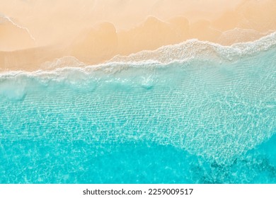 Summer seascape beautiful waves, blue sea water in sunny day. Top view from drone. Sea aerial view, amazing tropical nature background. Beautiful bright sea waves splashing and beach sand sunset light - Shutterstock ID 2259009517