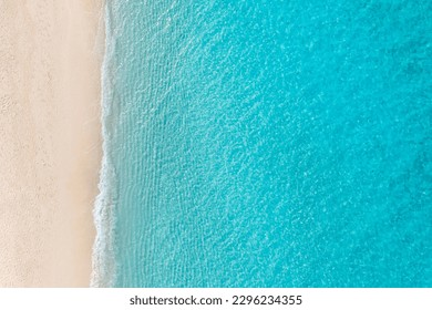Summer seascape beautiful waves, blue sea water in sunny day. Top view from drone. Relax sea aerial view amazing tropical nature background. Tranquil bright sea waves splashing beach sand sunset light - Shutterstock ID 2296234355