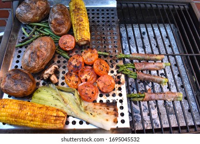 Summer Side Dishes Cooked On The Barbecue Corn On The Cob Mushrooms Green Beans Leeks Tomatoes Whole Red Potatoes Asparagus Wrapped In Prosciutto Ham Vegetables And Meaty Starter On The Outdoor Grill