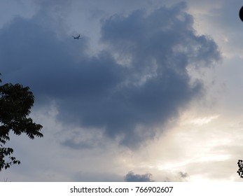 The summer sky with the floating dark clouds 