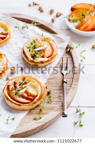 Similar – Puff pastry biscuits with nectarines, camembert and thyme