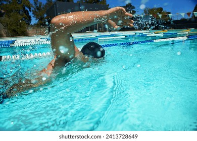 Summer, sport and athlete swimming in pool for competition, race or cardio training for triathlon. Fitness, workout and man exercise for health, wellness and practice stroke outdoor with water splash - Powered by Shutterstock