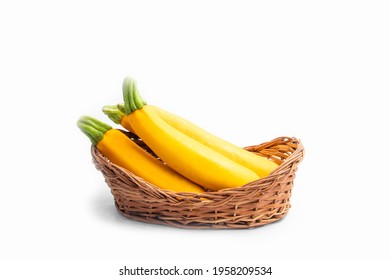 Summer Squash Zucchini Is Yellow Colored Gourd Also Known As Courgette, Baby Marrow, Indian Jugni Sabzi Or Jugnu Petha Sabji In Basket. Isolated On White Background With Copy Space For Text