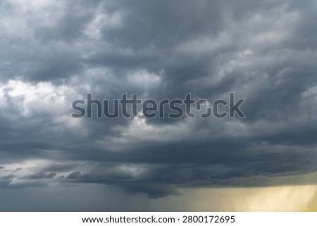 Summer storm clouds before a thunderstorm. Dark storm clouds before the rain. Bad weather. A heavenly landscape of clouds in the sky on a rainy day. Majestic cumulus clouds float across the endless sky. 