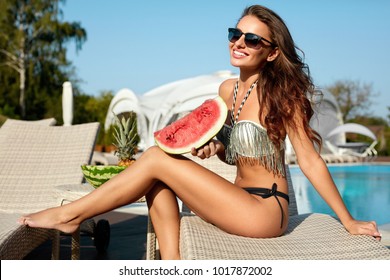 Summer Style. Woman In Fashion Bikini With Watermelon On Vacation. Happy Sexy Girl Sunbathing In Stylish Sunglasses And Fashionable Swimsuit Enjoying Weekend Near Swimming Pool. High Resolution.