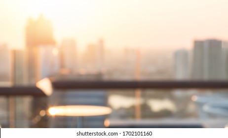 Summer Sun Blur Golden Hour Sky Sunset With City Rooftop View  Background Cityscape Office Building Landscape Blurry Urban Lights Skyline Bokeh For Evening Party 