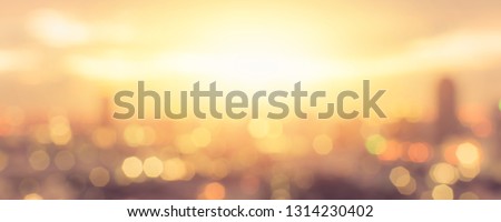 Summer sun blur golden hour sky sunset with city rooftop view background cityscape office building cbd landscape blurry urban warm hot heat wave lights skyline polygon bokeh for evening night party