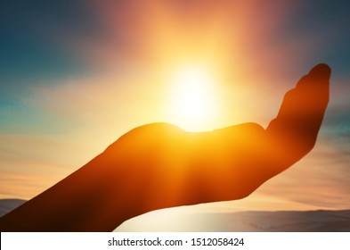 Summer sun solstice with human hands silhouette