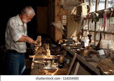 Summer sunlight shining through a window of an old carpentry shed - Powered by Shutterstock