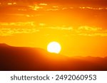 Summer sunrise behind the San Gabriel Mountains in Los Angeles California.  