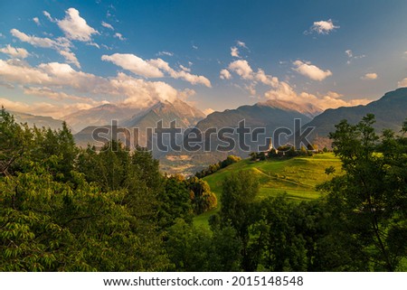 Summer sunset between the clouds in the mountains of Valle d'Aosta