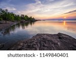 Summer Sunset At The Lake. Beautiful sunset over the horizon of Lake Superior at Copper Harbor in the Upper Peninsula of Michigan.