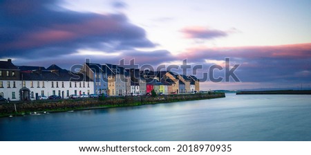 Summer sunset over Galway, Ireland with colorful houses. 