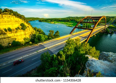 Summer sunset at Pennybacker Bridge or 360 Bridge Historic Landmark Suspension Bridge in Austin , Texas , USA - Spanning across Colorado River or Town Lake summer time sunset landscape