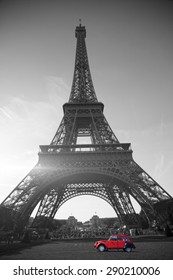 summer sunset vintage red car stands on the Champ de Mars Eiffel Tower. black and white photo
