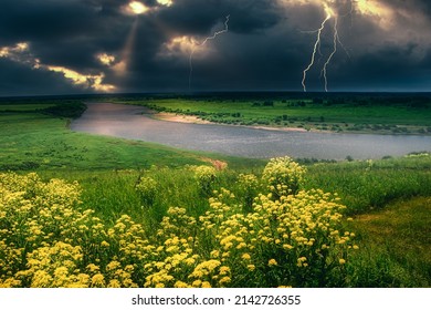 summer thunderstorm over the lightning river top view yellow meadow of flowers on the hill                         - Shutterstock ID 2142726355