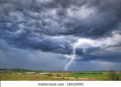Summer thunderstorm over the meadow in Poland