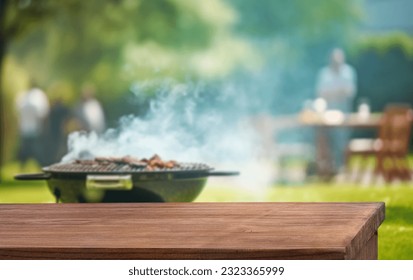 summer time in backyard garden with grill BBQ, wooden table, blurred background - Powered by Shutterstock