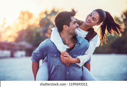 Summer Time. Beautiful Young Couple Enjoying In Good Mood On The Beach. Lifestyle, Love, Dating, Vacation Concept