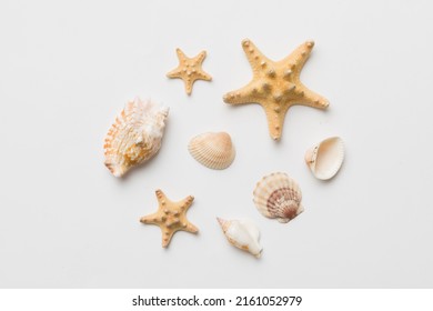 Summer time concept Flat lay composition with beautiful starfish and sea shells on colored table, top view. - Shutterstock ID 2161052979