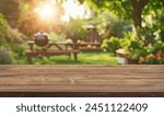 summer time party in backyard garden with grill BBQ, wooden table, blurred background