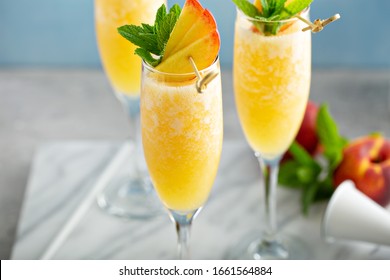 Summer Time Peach Mimosa Or Bellini In Flute Glasses, Brunch Cocktail